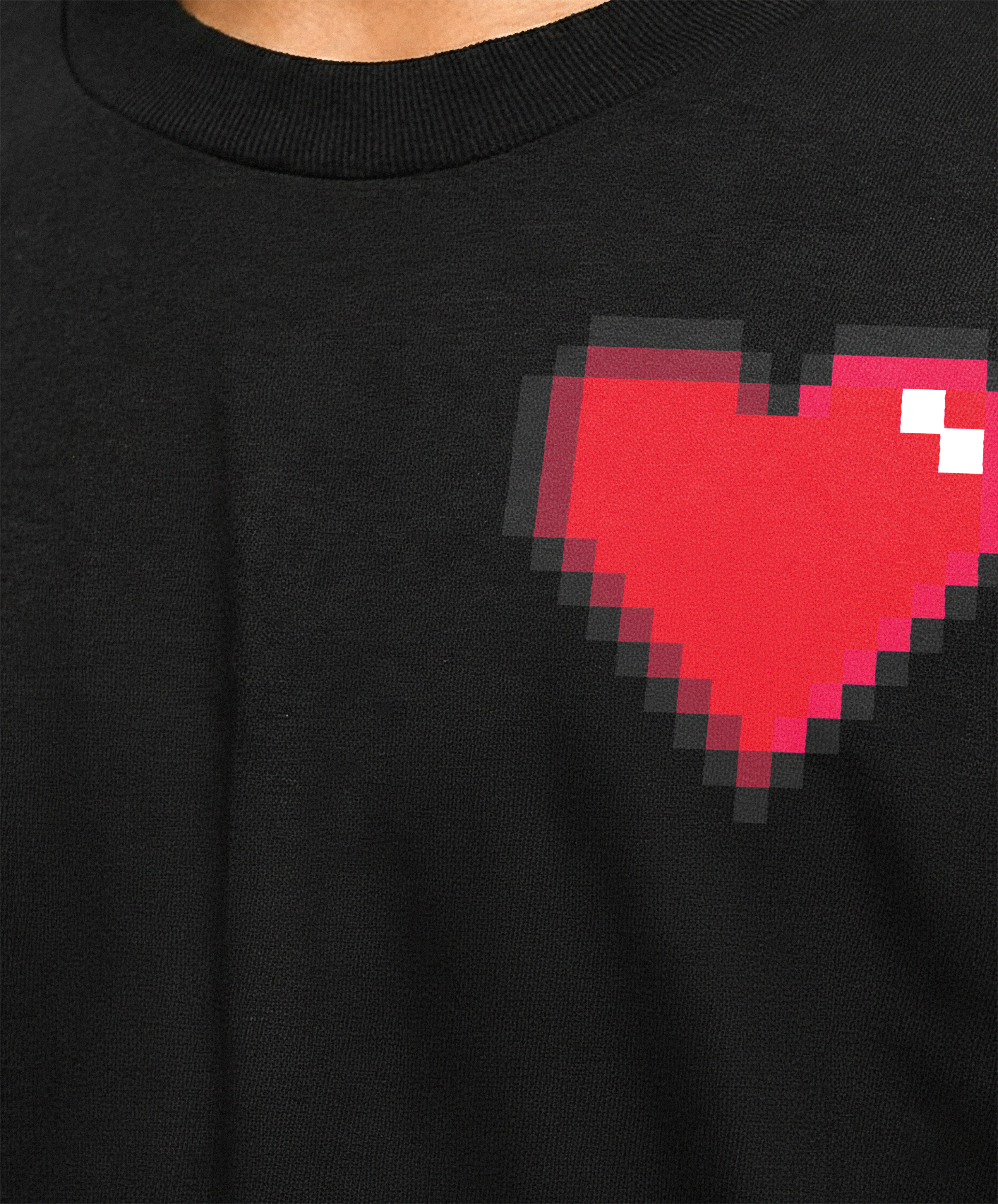 close up of a retro style heart on a black tshirt