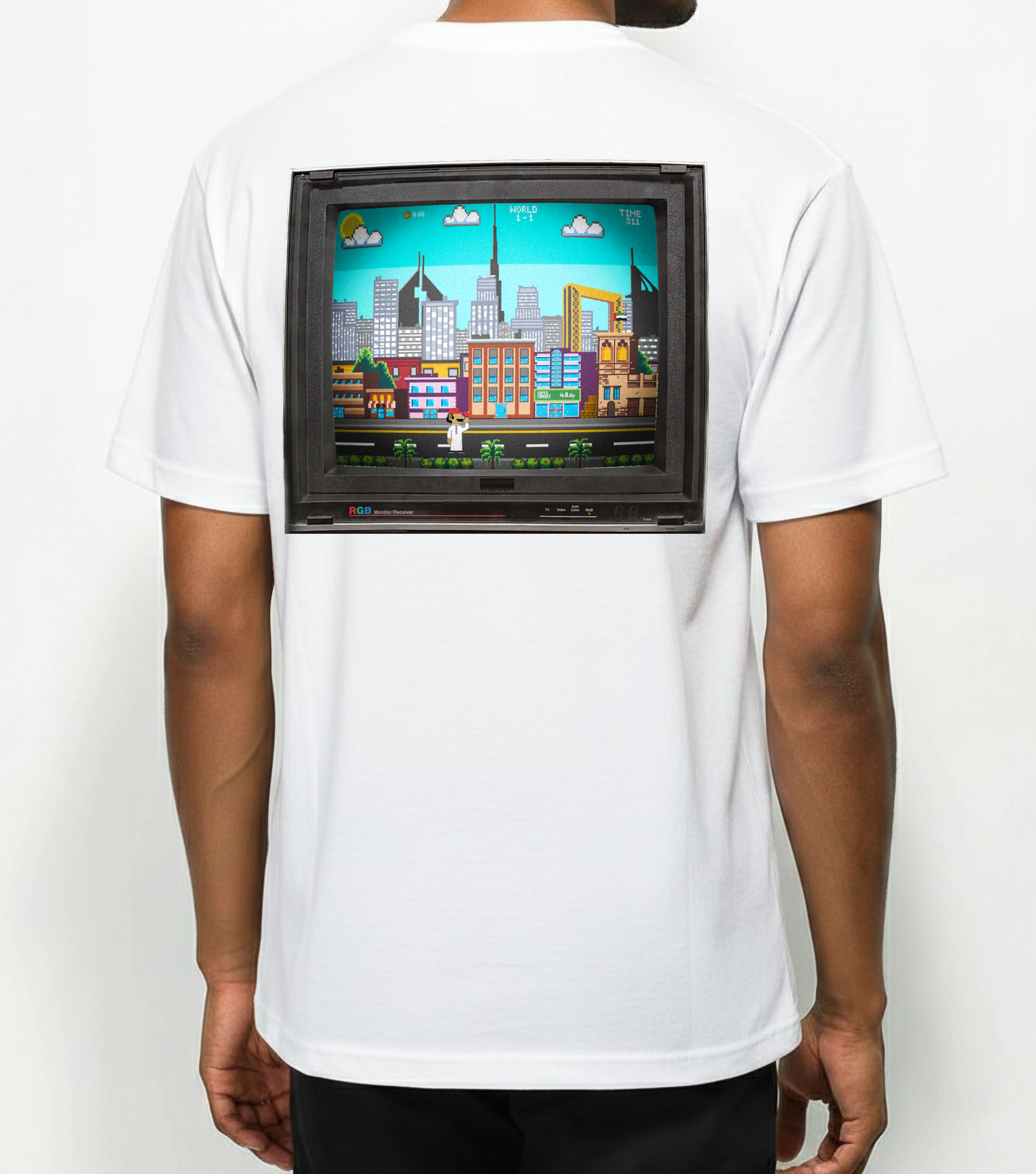White t-shirt with a graphic of a retro video game console and cityscape on the back.