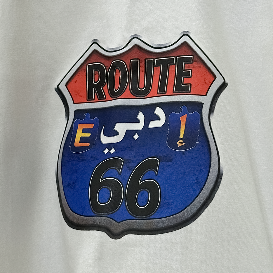 Route 66 sign with Arabic text on a gray background